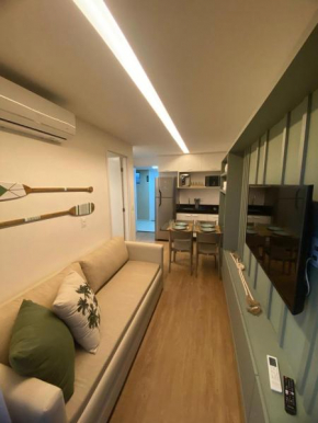 Charmoso Flat pé na areia